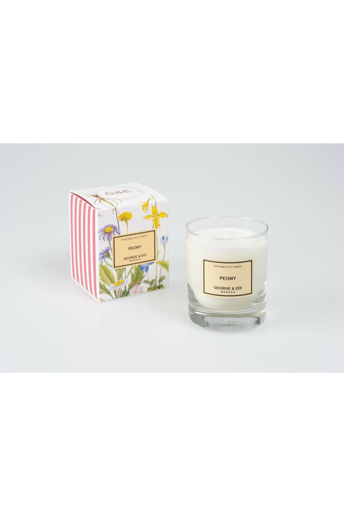 Standard Size George & Edi Peony Candle sitting in front of its Floral signature packing box.