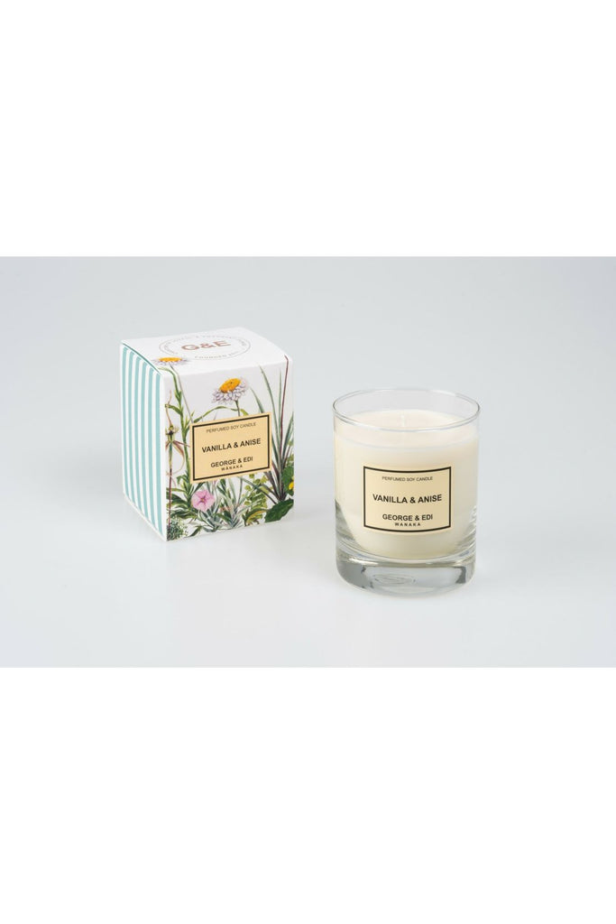 Standard Size George & Edi Vanilla & Anise Candle sitting in front of its Floral signature packing box.