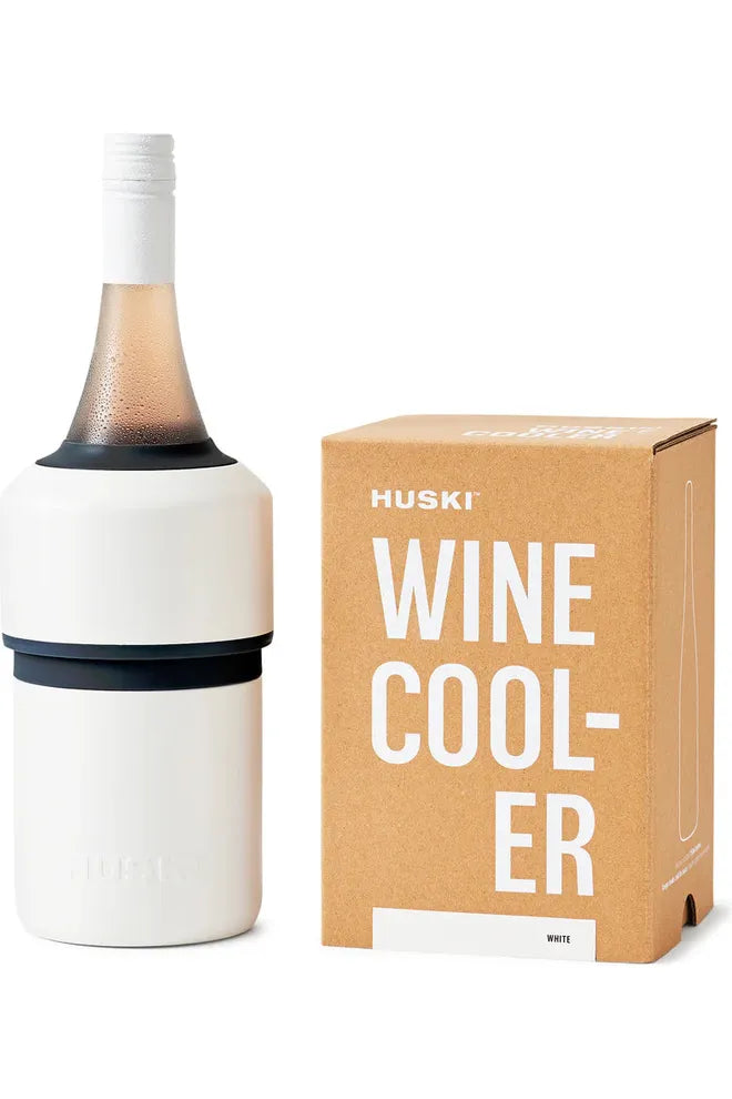 Huski White Wine Cooler. Image shows Wine Cooler holding a chilled bottle of wine standing alongside the kraft die cut gifting box the Wine Cooler comes in.