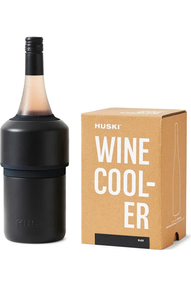 Huski Wine Cooler Black. Image shows Wine Cooler with cold bottle of Rose in it, sitting beside kraft gift box that the Wine Cooler is sold in.