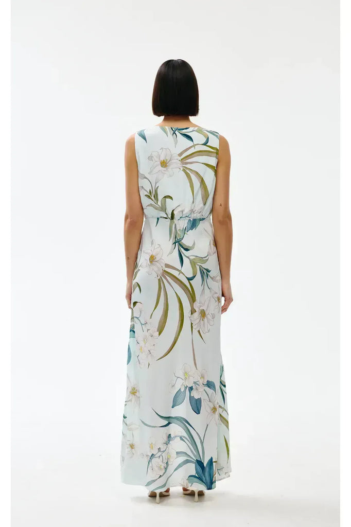 Woman wearing a floral sleeveless dress on a white background. Kinney Alice dress in Portofino print.