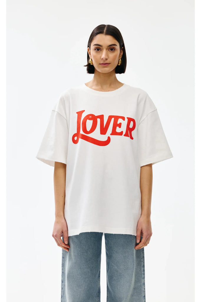 Person wearing a white t-shirt with 'LOVER' in red text on a white background