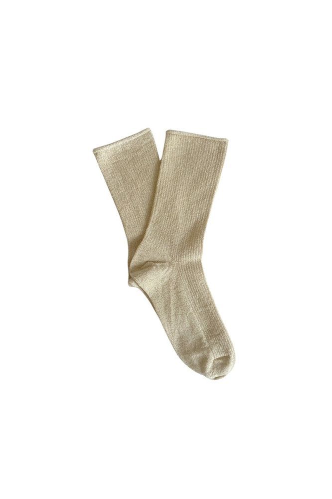 Pair of beige socks on a white background