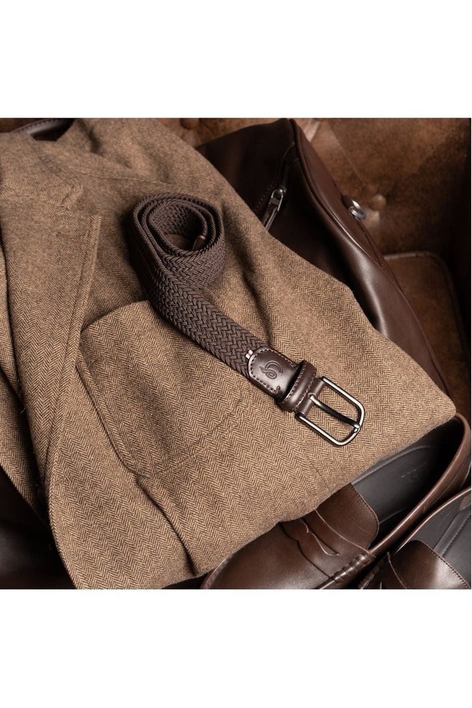 La Boucle Brown woven belt on a brown textured blazer with shoes in the foreground