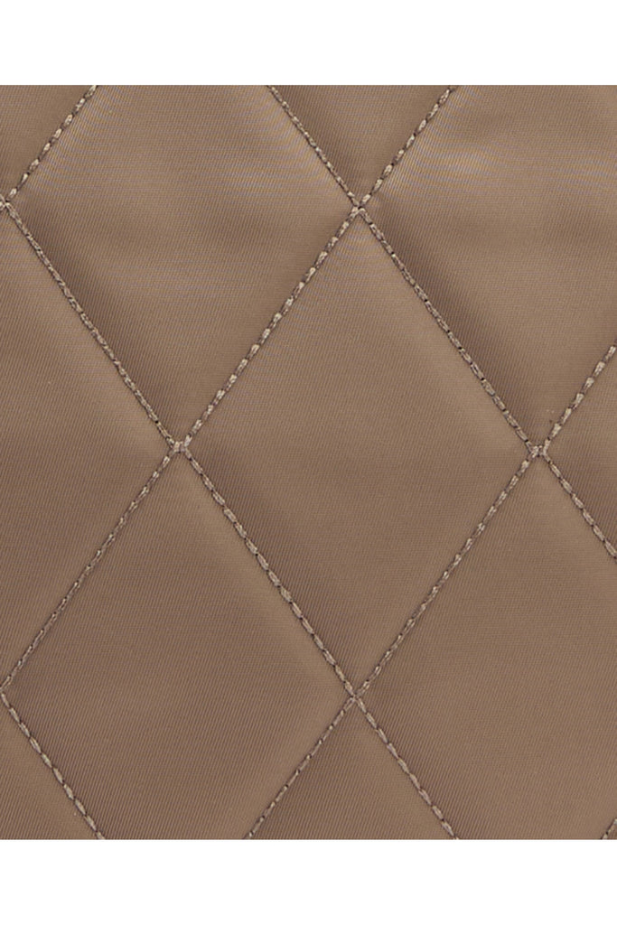 Quilted beige handbag on a light gray background. Barbour Quilted crossbody bag in sand.