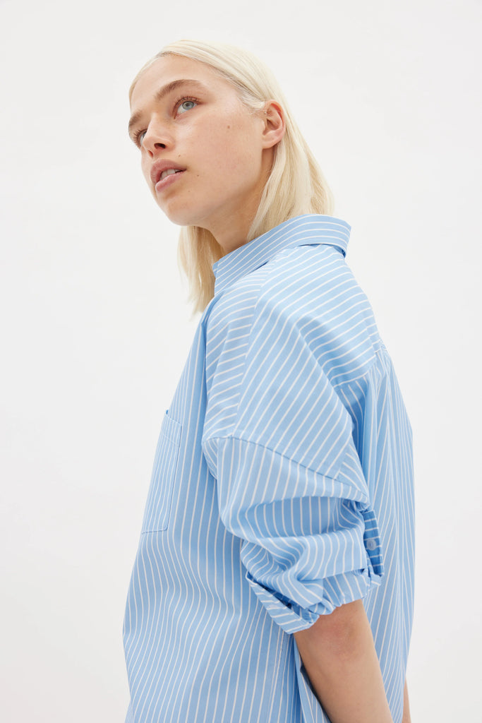 LMND Chiara Midi Length Cotton Shirt long sleeves light blue and white stripe side view on model