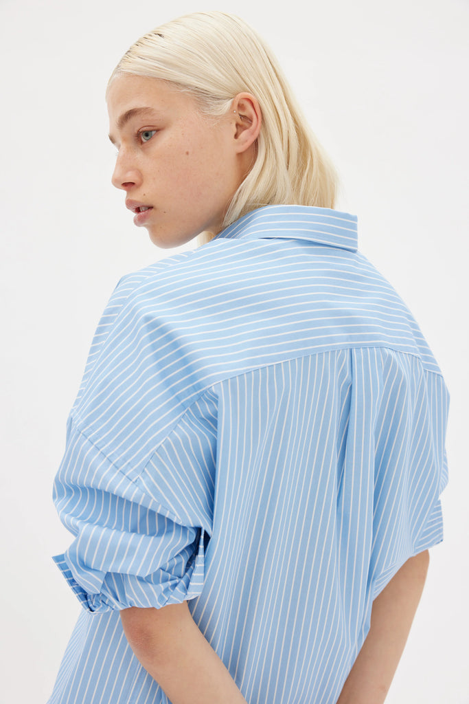 LMND Chiara Midi Length Cotton Shirt long sleeves light blue and white stripe back view on model