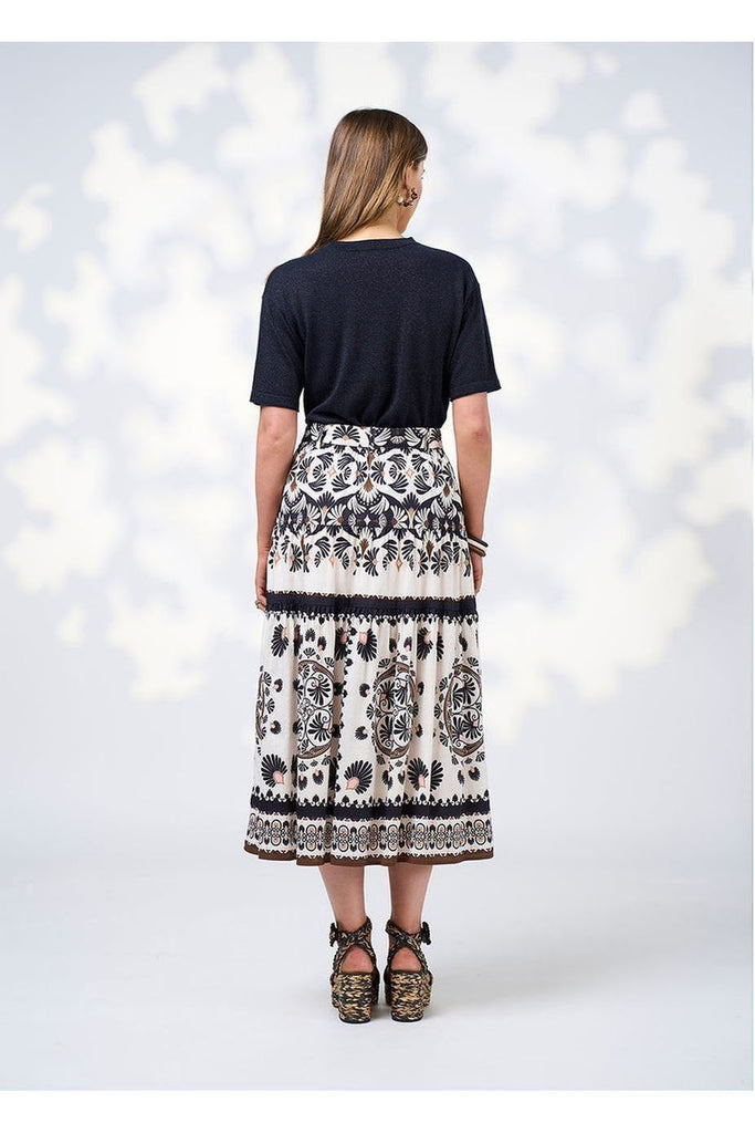 Woman wearing a navy tee with Loobies Story Zoe Skirt