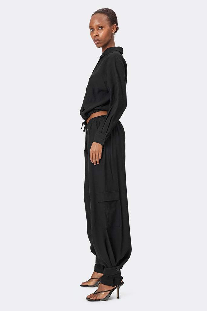 Lolllys Laundry Black Baja Pants with the black Tobago Shirt on model side view