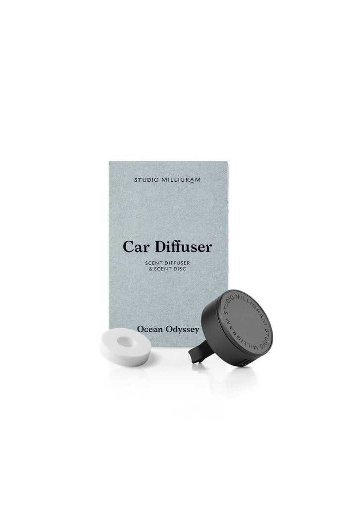 Studio Milligram car diffuser set with packaging on a white background