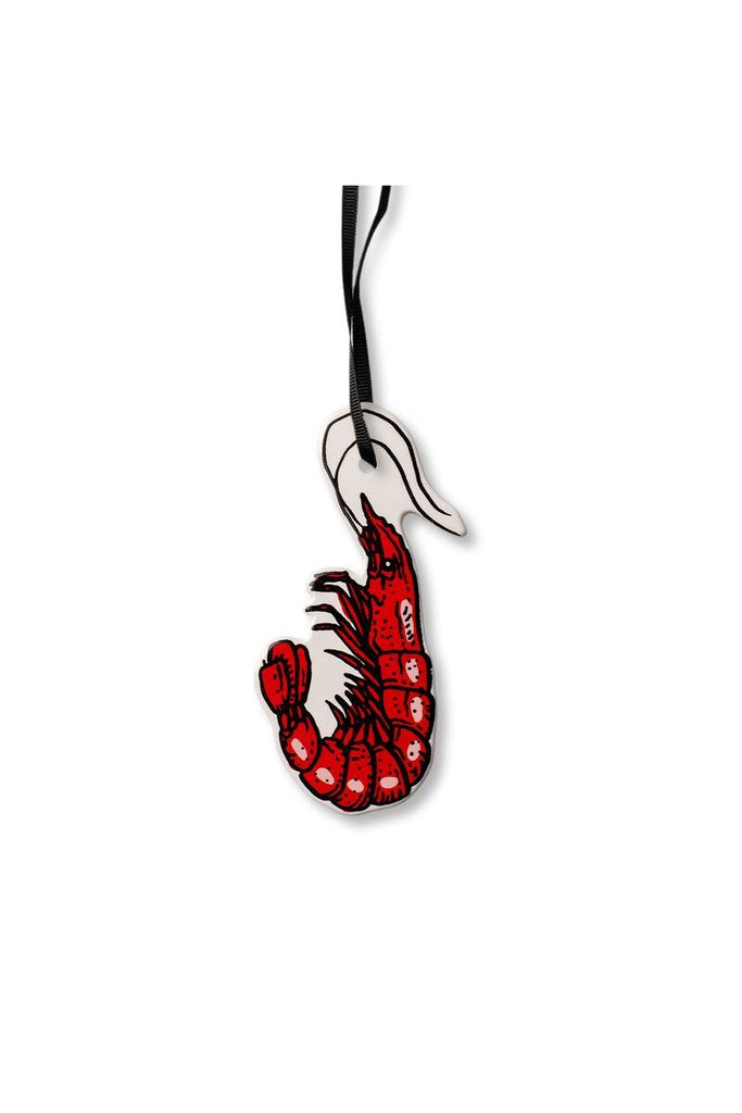 A whimsical glazed ceramic prawn hanging decoration by Billie Justice Thomson for Studio Milligram, perfect for your Christmas tree or mantelpiece. 
