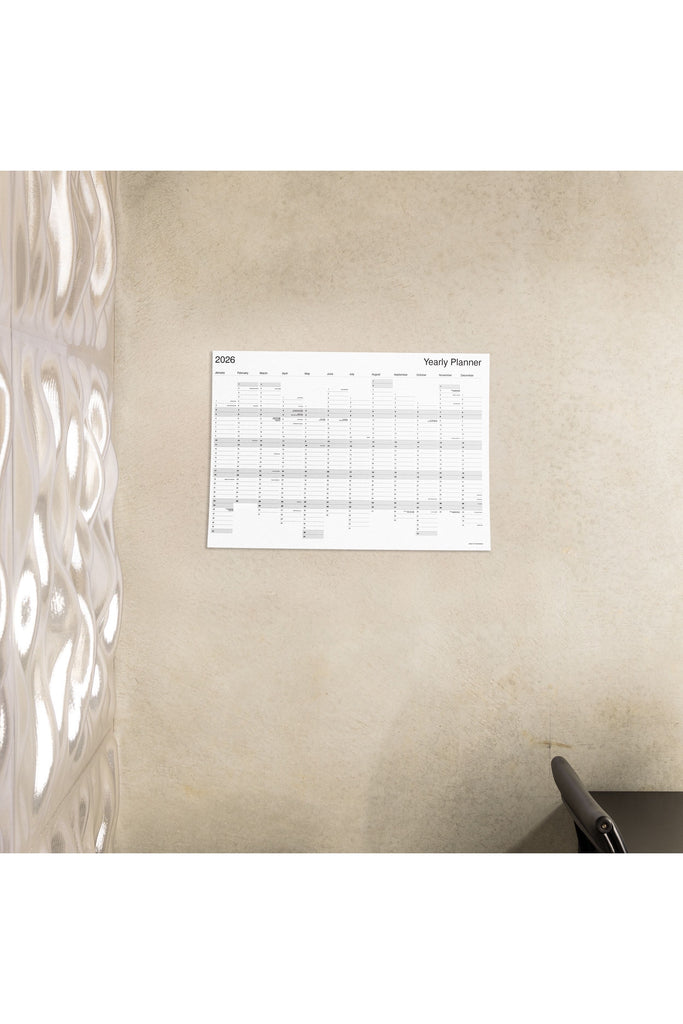 Made of Tomorrow Medium Size 2026 yearly planner on a beige wall