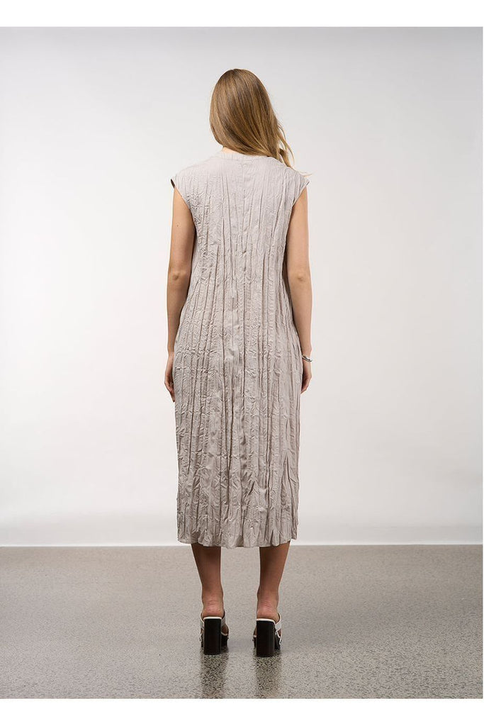 Woman wearing a sleeveless dress with a white background, Madly Sweetly Ripple Dress in Pumice