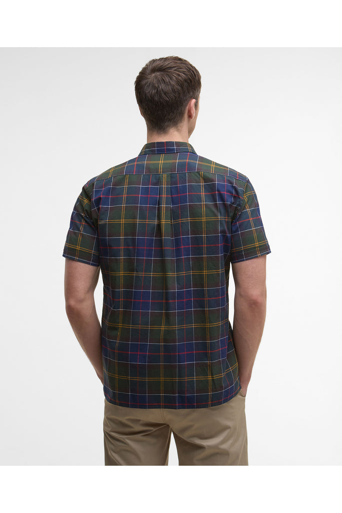Man wearing a plaid shirt and beige pants on a white background. Barbour Gordon Summer Shirt in Classic Tartan.