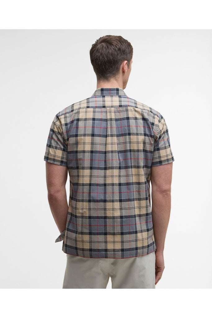 Man wearing a plaid short-sleeve shirt on a plain background. Barbour Gordon Summer Shirt in Dress Tartan.