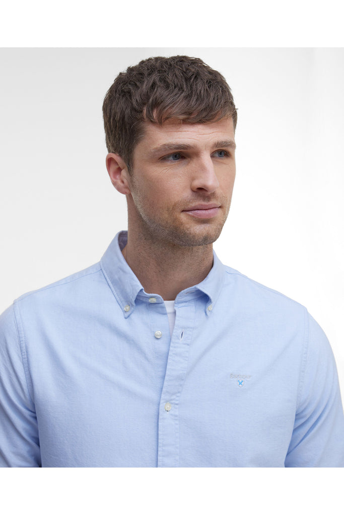 Man wearing a Barbour light blue button-up shirt against a plain background. The Barbour Oxtown Tailored Shirt in Sky.