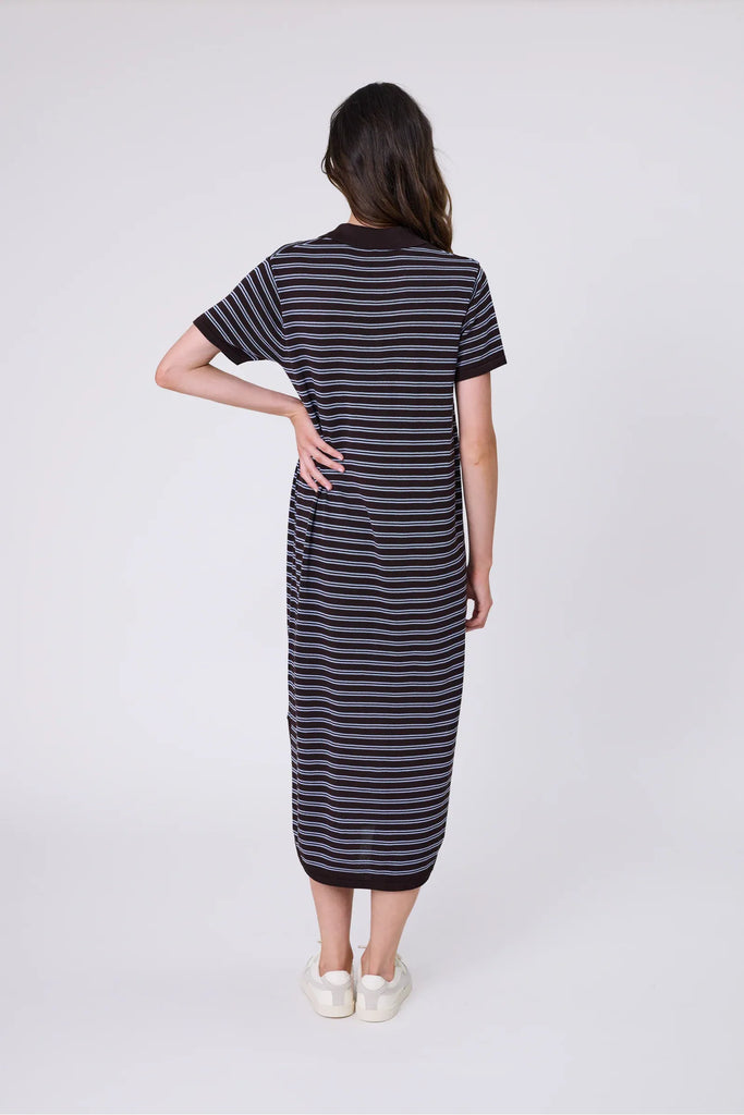 Woman wearing a chocolate brown and blue striped polo dress on a white background. Marlow Chime Knit Polo Dress in Carob Stripe.