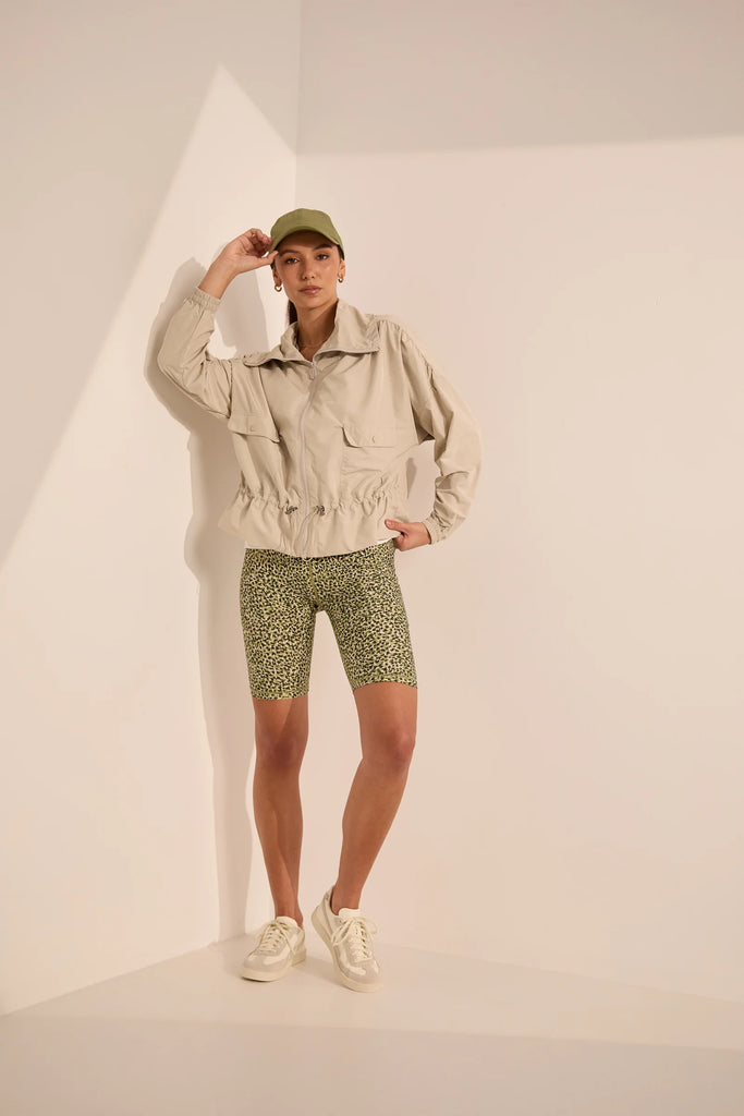 Person wearing green patterned shorts on a plain background. Marlow Circuit Bike Short in a green Willow Print.