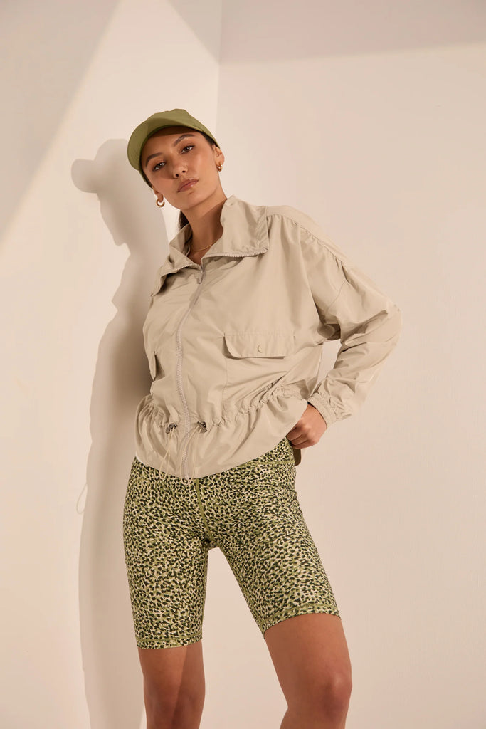 Person wearing green patterned shorts on a plain background. Marlow Circuit Bike Short in a green Willow Print.