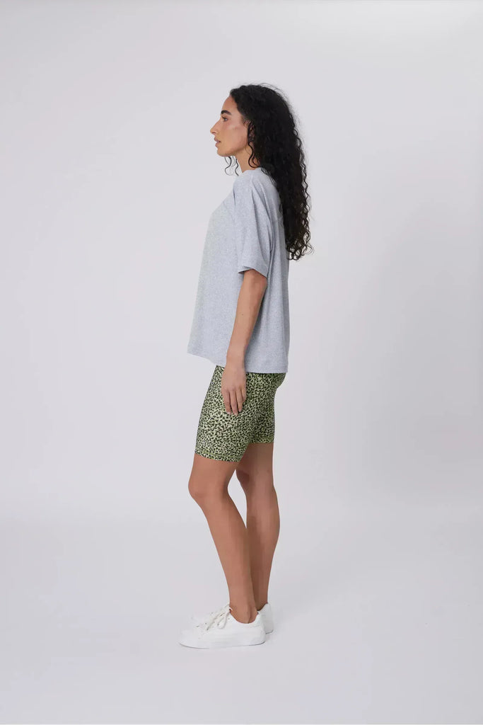 Person wearing green patterned shorts on a plain background. Marlow Circuit Bike Short in a green Willow Print.