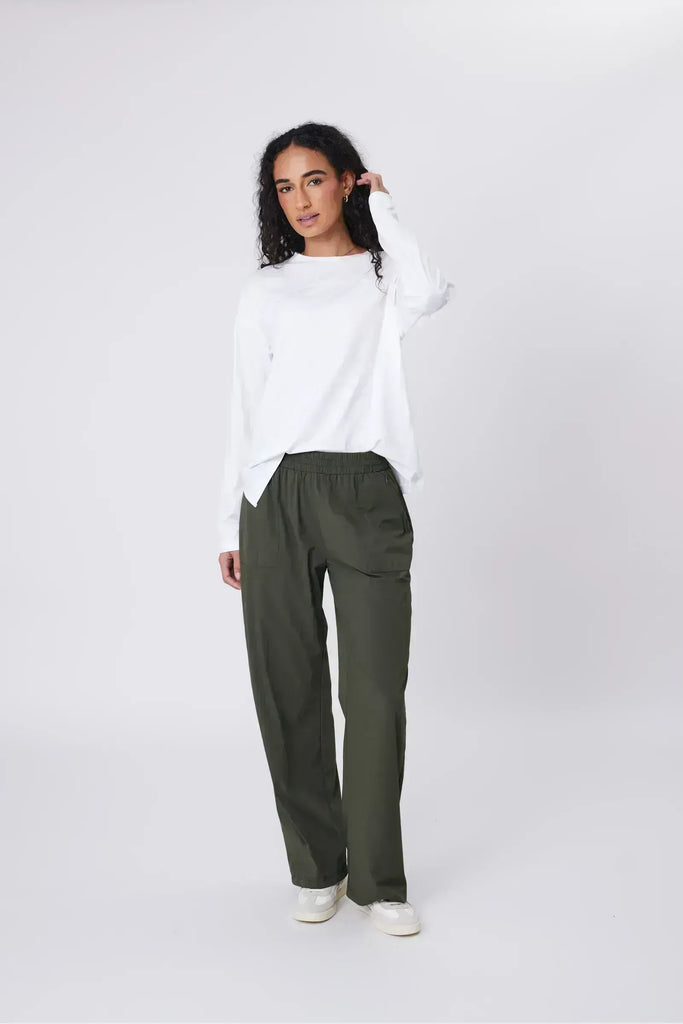 Person wearing green pants on a white background. Marlow Intrepid Pant 2.0 Olive.