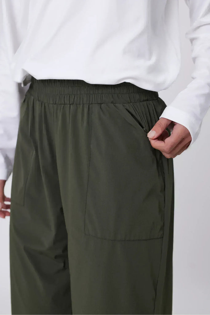 Person wearing green pants on a white background. Marlow Intrepid Pant 2.0 Olive.