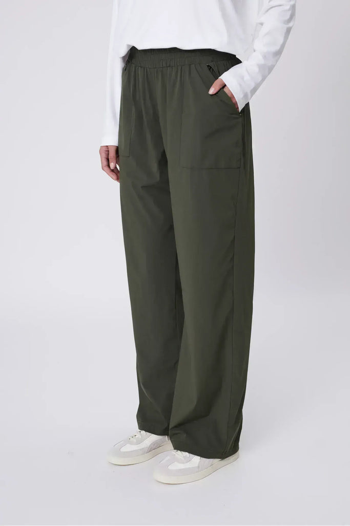 Person wearing green pants on a white background. Marlow Intrepid Pant 2.0 Olive.