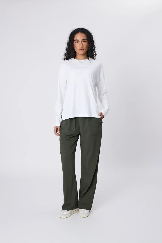 Person wearing green pants on a white background. Marlow Intrepid Pant 2.0 Olive.