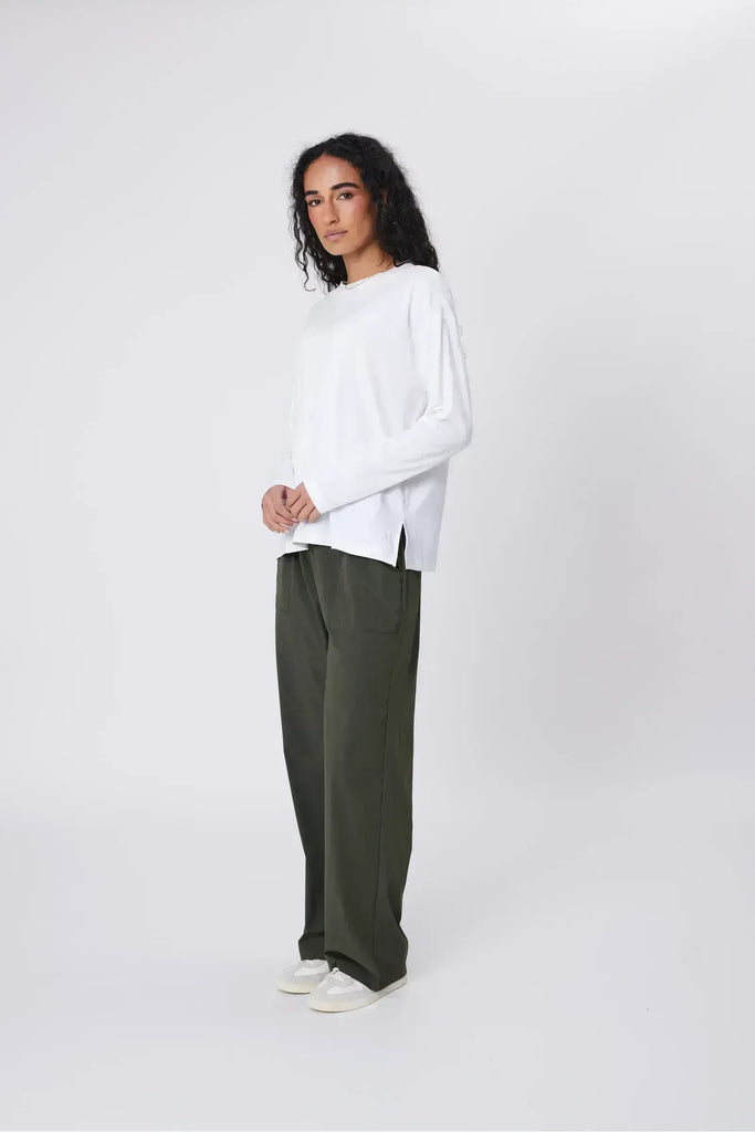 Person wearing green pants on a white background. Marlow Intrepid Pant 2.0 Olive.