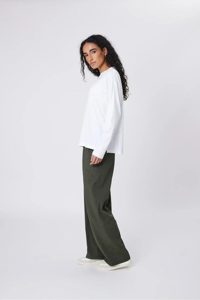 Person wearing green pants on a white background. Marlow Intrepid Pant 2.0 Olive.