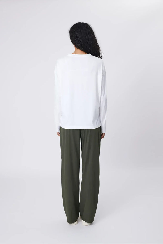 Person wearing green pants on a white background. Marlow Intrepid Pant 2.0 Olive.