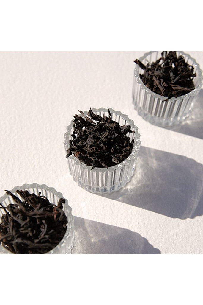 On Sundays Loose Leaf Organic English Breakfast Tea Leaves.  Image shows  tea leaves sitting in glass vessels.