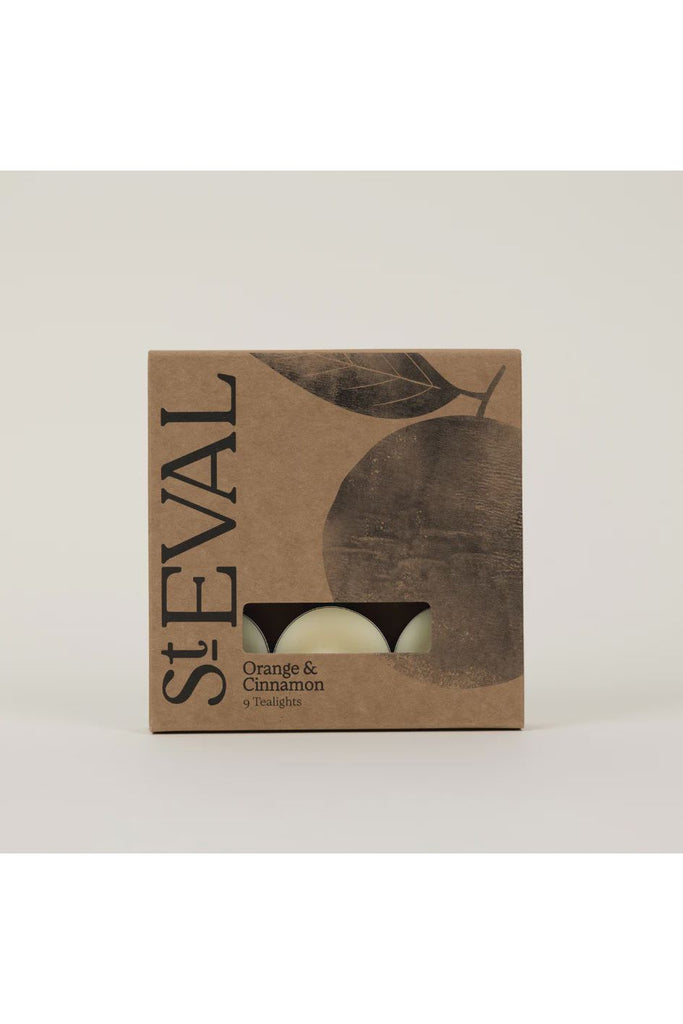 St Eval Orange & Cinnamon tealights packaging on a beige background