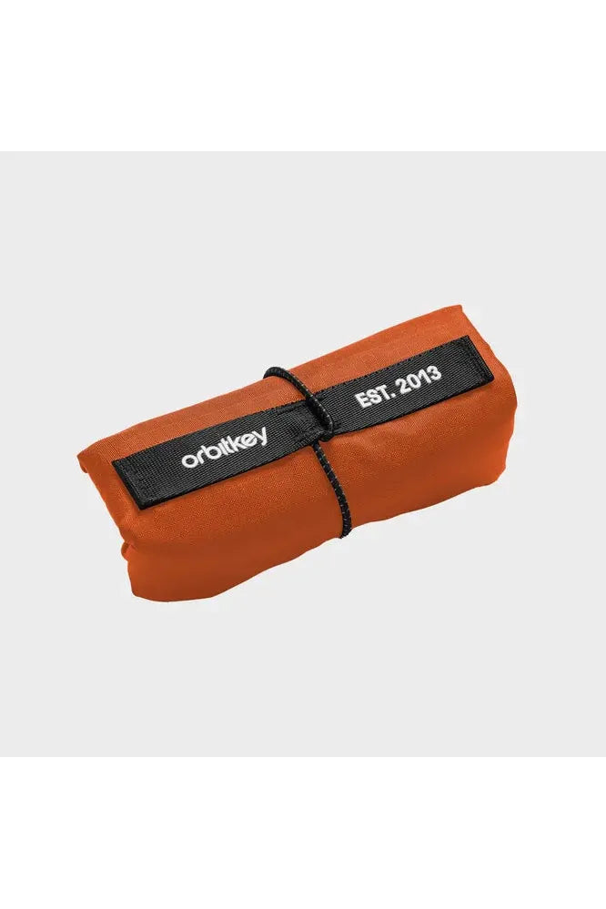 Orbitkey_Foldable_Tote_Limited_Edition_Tangerine._Image_shows_folded_and_secured.