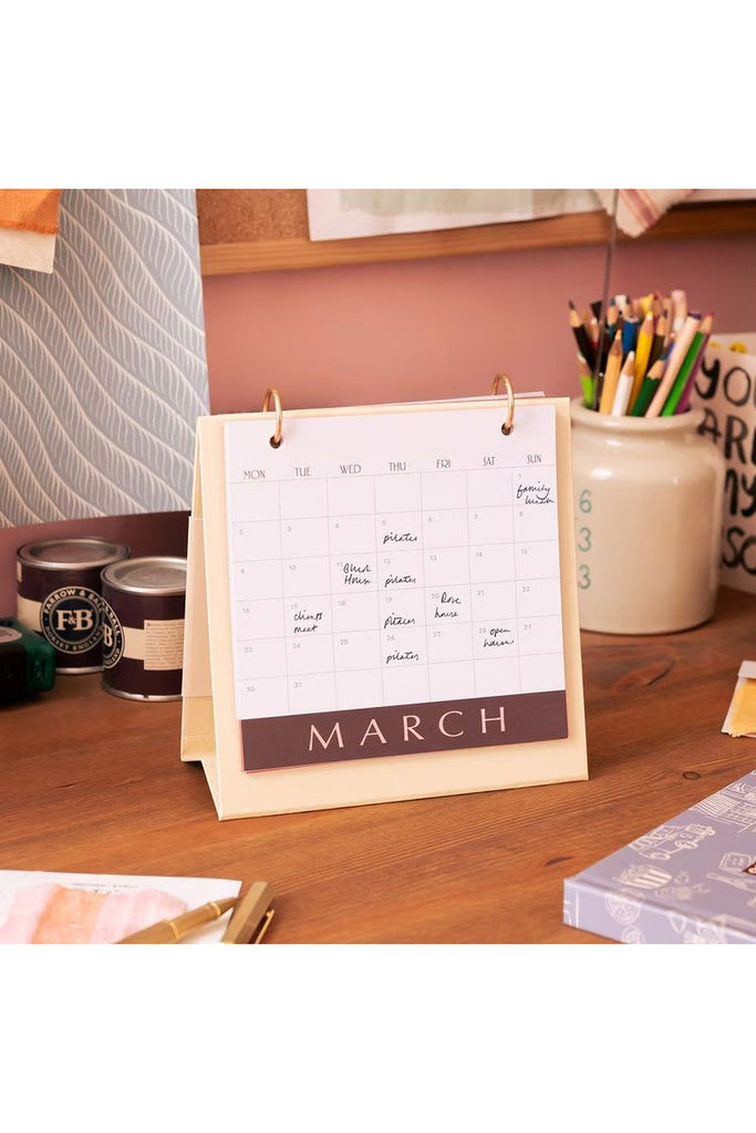 Papier 2026 Desk Calender open at the March calendar on a wooden desk with stationery items