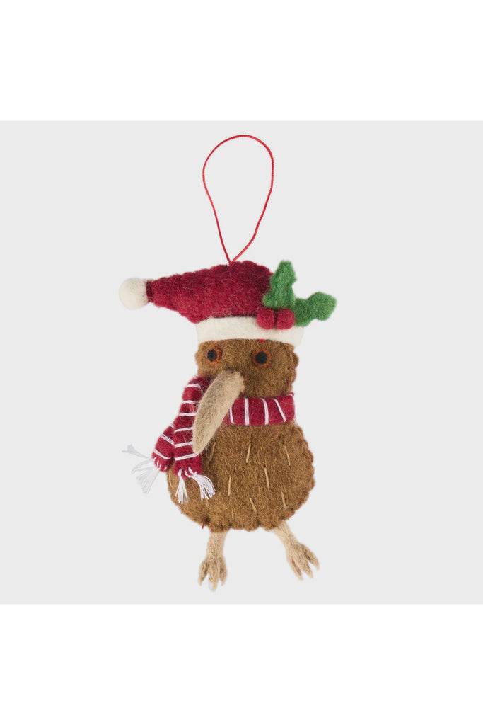 Handmade felt Kiwi bird Christmas ornament wearing a Santa hat with holly, hanging on a tree, New Zealand-inspired festive décor.