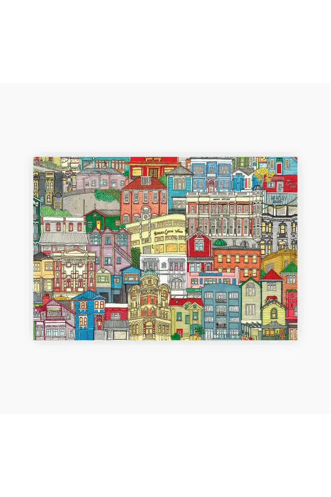 Piece House collaborates with Stacey Fraser Allen on a puzzle called "Neighborhood Puzzle." The image depicts the completed puzzle, which showcases a colorful Wellington cityscape featuring various elements.turing various elements.buildings.