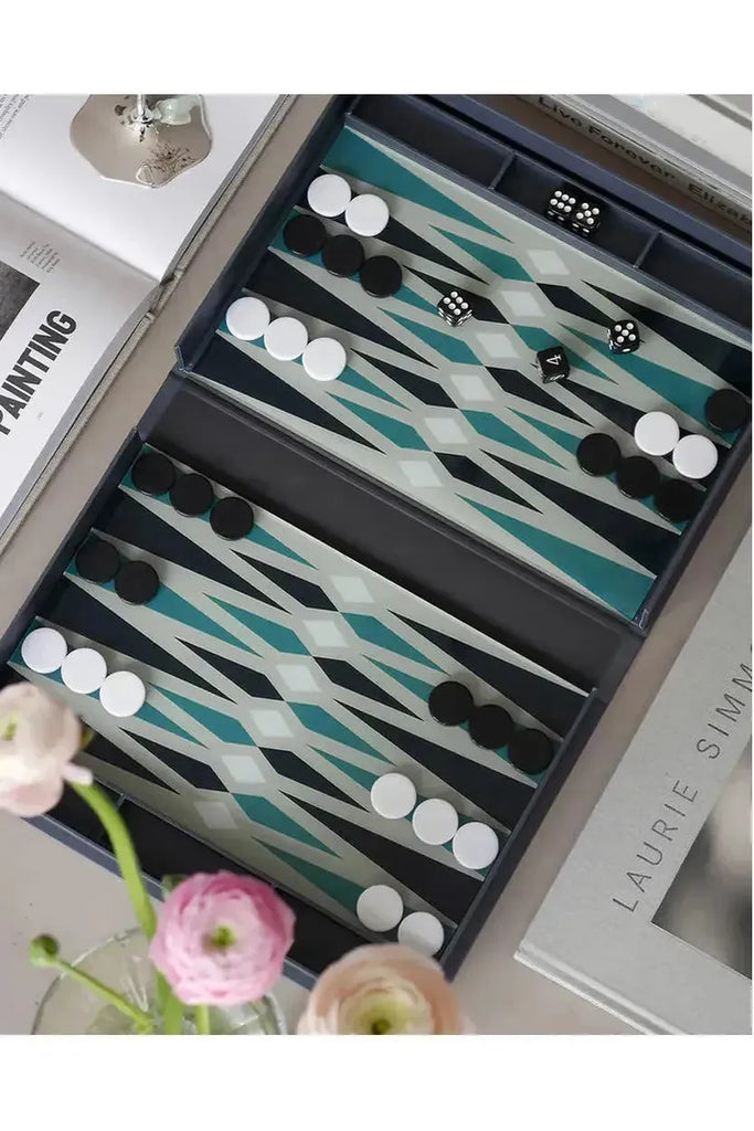 Printworks Backgammon Classic set features a book-like gameboard, opened to display playing pieces and dice on the decorative board.