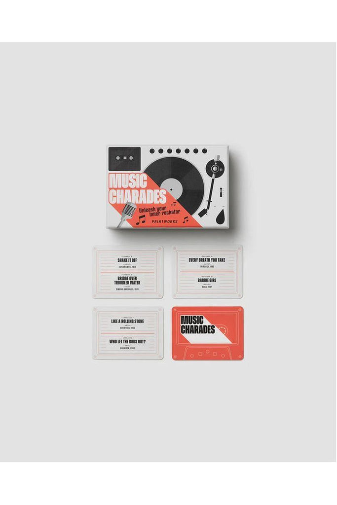 Printworks Music Charades card game packaging with four cards displayed on a white background.