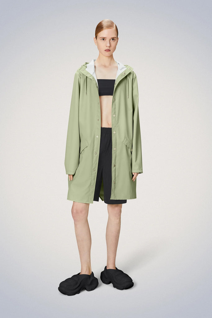 Rains Long Jacket Earth Green on model front view un-buttoned