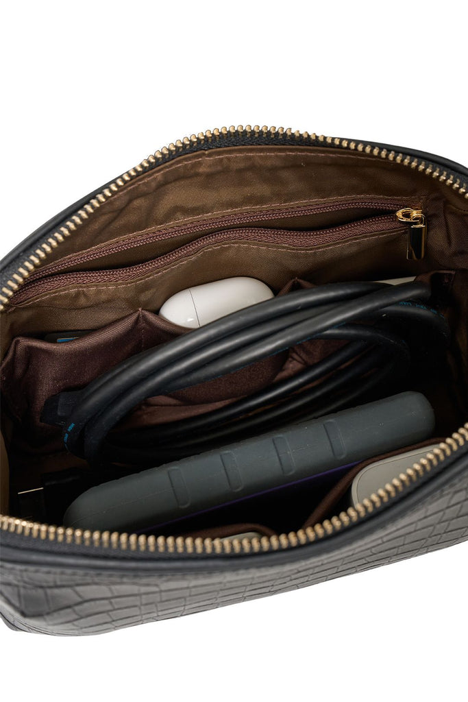 Black crocodile-patterned travel pouch on a white background. Saben Tate Tech Pouch in Black Croc Leather.