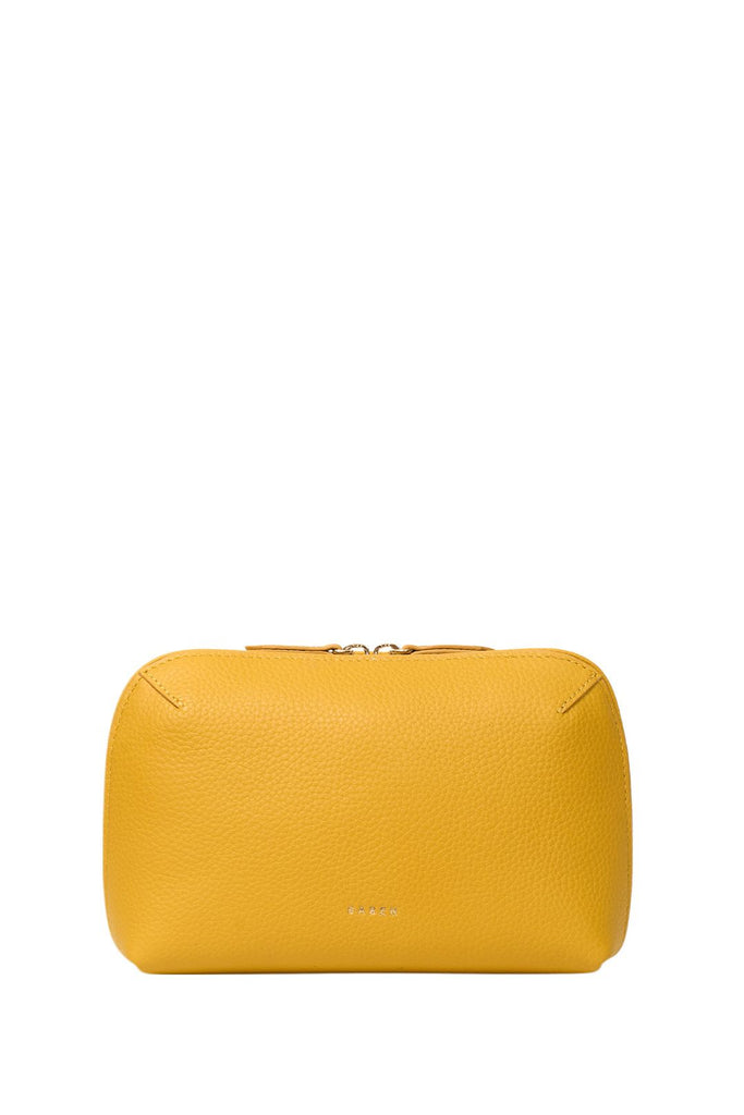 Yellow leather pouch on a white background. Saben Tate Tech Pouch in Marigold yellow leather.