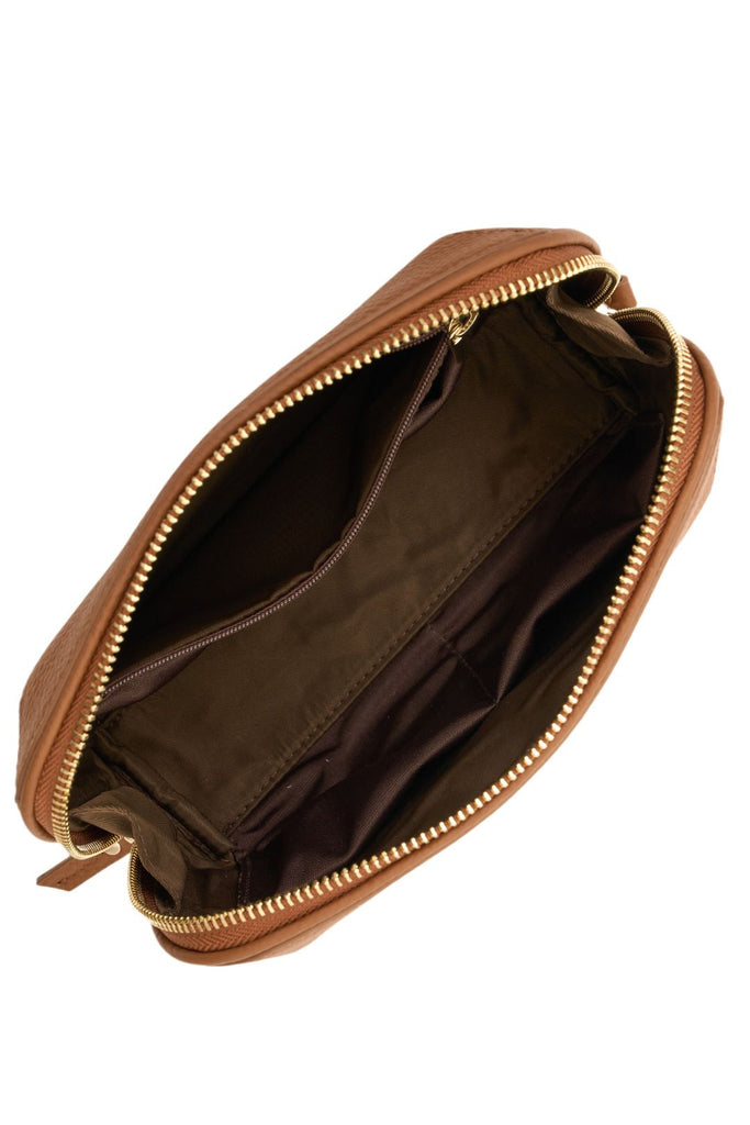 Brown leather pouch with gold zipper on a white background. Saben Tate Tech Pouch in Tan leather