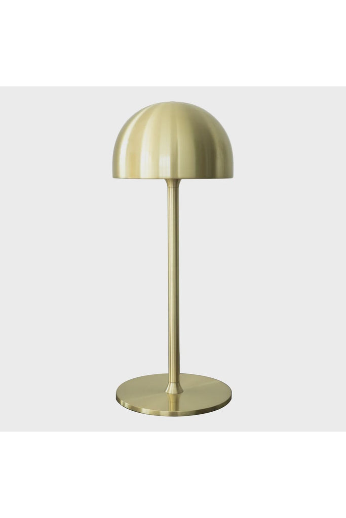 Sirius Tim  Rechargeable Lamp. Golden Brass table lamp on a white background.