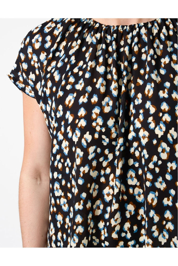 Close up of a Woman wearing a Stella and Gemma Clio Top in Navy Leopard print against a white background