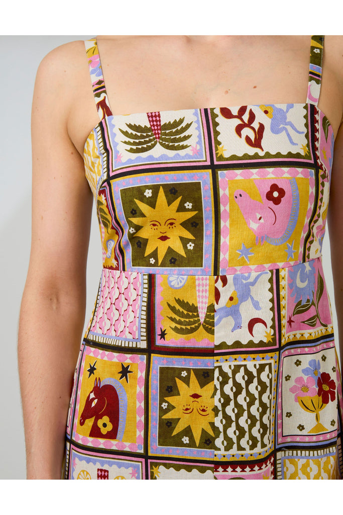 Woman wearing a colorful patchwork dress on a white background. Stella and Gemma Jude Dress in the Memories Of Morocco print