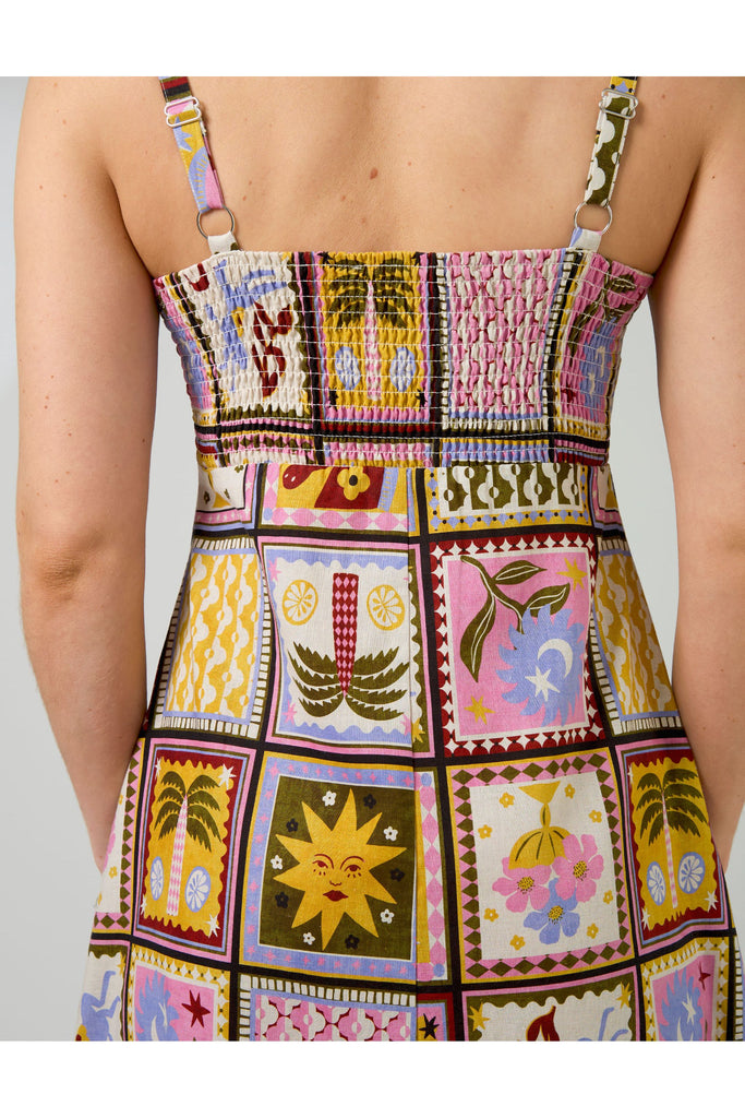 Woman wearing a colorful patchwork dress on a white background. Stella and Gemma Jude Dress in the Memories Of Morocco print
