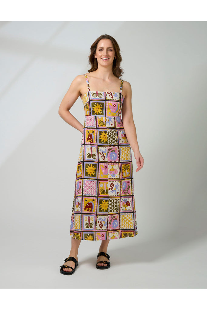 Woman wearing a colorful patchwork dress on a white background. Stella and Gemma Jude Dress in the Memories Of Morocco print