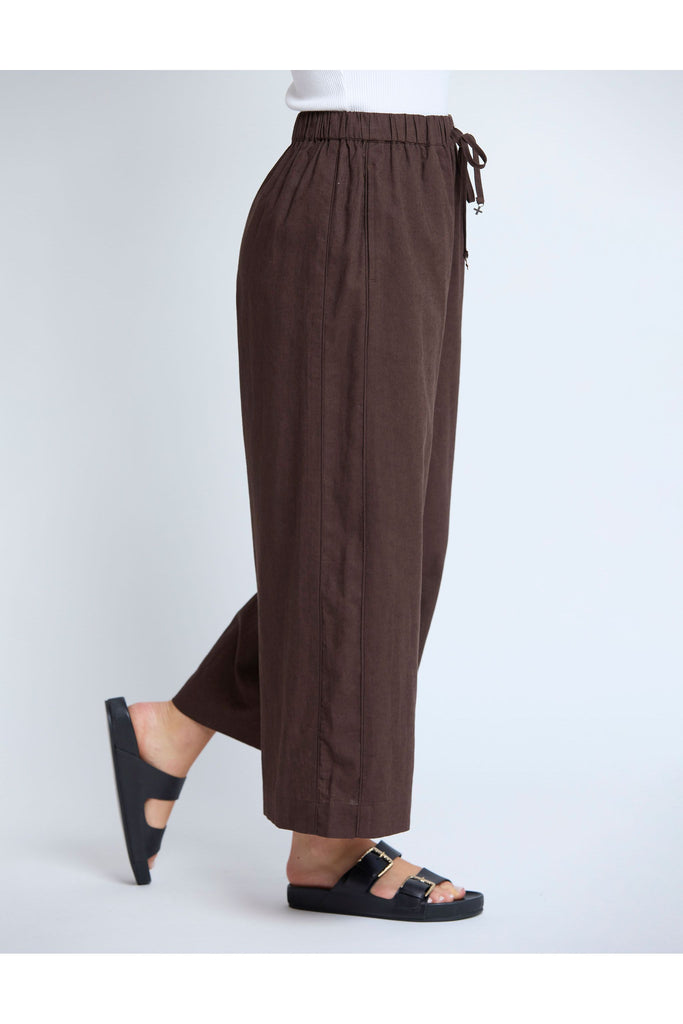 Brown wide-leg pants with drawstring waist on a white background