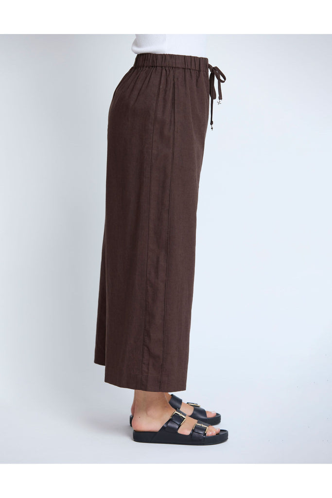 Brown wide-leg pants with drawstring waist on a white background